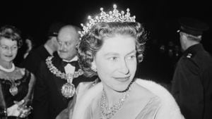 Queen Elizabeth II attends a performance at RADA (the Royal Academy of Dramatic Art), to celebrate the drama school's Diamond Jubilee (60th anniversary), London, UK, November 1964. (Photo by Terry Disney/Express/Getty Images)