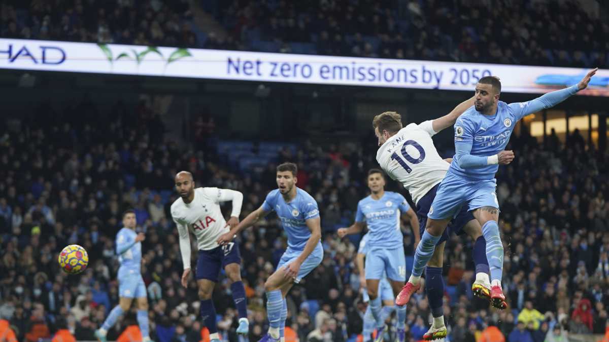 Tottenham's Harry Kane, second right, scores his side's third goal during the English Premier League soccer match between Manchester City and Tottenham Hotspur, at the Etihad stadium in Manchester, England, Saturday, Feb. 19, 2022. (AP/Jon Super)