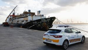 A police car is seen as police officers discharge drugs from the cattle ship Orion V seized off the Canary Islands, in the port of Las Palmas, in the island of Gran Canaria, Spain, January 26, 2023. REUTERS/Borja Suarez
