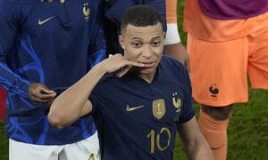 France's Kylian Mbappe gestures at the end of the World Cup round of 16 soccer match between France and Poland, at the Al Thumama Stadium in Doha, Qatar, Sunday, Dec. 4, 2022. (AP Photo/Christophe Ena)