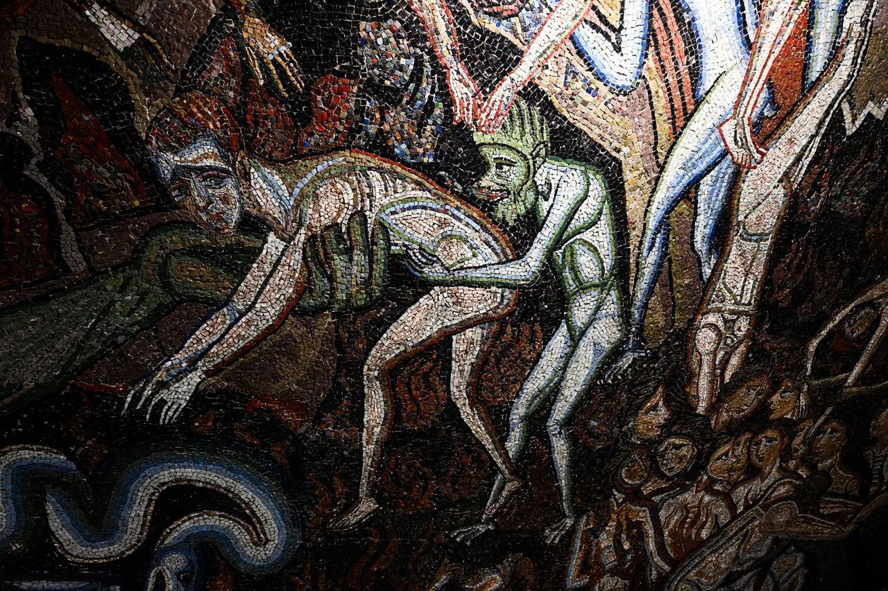 A view shows a detail of the section "Inferno" (Hell) of the mosaic ceiling of the Baptistery of San Giovanni, one of the most ancient churches in Florence, Tuscany, during the presentation of the start of a six-year restoration of its mosaic ceiling, on February 8, 2023. - The mosaic ceiling of the Florence Baptistery, a set of mosaics covering the internal dome and apses, is one of the most important cycles of medieval Italian mosaics, created between 1225 and around 1330 using designs by major Florentine painters. (Photo by Vincenzo PINTO / AFP)