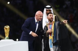 Soccer Football - FIFA World Cup Qatar 2022 - Final - Argentina v France - Lusail Stadium, Lusail, Qatar - December 18, 2022 Argentina's Lionel Messi with FIFA president Gianni Infantino and the Emir of Qatar Sheikh Tamim bin Hamad Al Thani before lifting the World Cup trophy REUTERS/Carl Recine