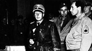 File picture dated 1945, showing Nazi SS - Standartenfuhrer Walter Rauff , center, shortly after being arrested at the Regina Hotel in Milano, Italy, January 21, 1984. Rauff, who is the object of a warrant for arrest issued in March 1961 by the Hanover Attorney general for the murder of more than 97,000 Jews by mobile gas vans, lives in Chile ever since the fifties. Nazi criminal hunter Serge Klarsfeld' s wife, Beate Klarsfeld, arrived Thursday in Santiago, Chile, to try to obtain Rauff's expulsion and for this to condut a public and media campaign in Chile. (AP Photo)