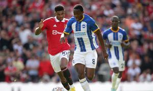 Manchester United's Marcus Rashford (left) and Brighton and Hove Albion's Enock Mwepu during the Premier League match at Old Trafford, Manchester. Picture date: Sunday August 7, 2022. (Photo by Ian Hodgson/PA Images via Getty Images)