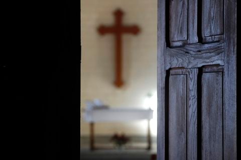 Protestant church.  Altar and christian cross.  France.