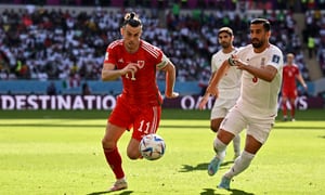 Soccer Football - FIFA World Cup Qatar 2022 - Group B - Wales v Iran - Ahmad Bin Ali Stadium, Al Rayyan, Qatar - November 25, 2022 Wales' Gareth Bale in action with Iran's Ehsan Hajsafi REUTERS/Dylan Martinez