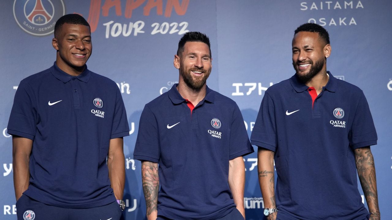 CORRECTS DATE - Paris Saint-Germain soccer players, Kylian Mbappe, left, Lionel Messi, center, and Neymar pose for photographers during a press conference in Tokyo Sunday, July 17, 2022. Paris Saint-Germain is in Japan for their pre-season tour.(AP/Shuji Kajiyama)
