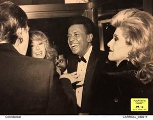 This image released by Kaplan Hecker & Fink and presented as evidence during former President Donald Trump's deposition shows E. Jean Carroll, second from left, and her then-husband John Johnson, center, meeting Trump, at left, and his wife Ivanka at an event in the 1980's. During his deposition, Trump mistook Carroll as Marla Maples, his ex-wife, when shown the image. The video recording of Trump being questioned about the rape allegations against him was made public for the first time Friday, May 5, 2023, providing a glimpse of the Republican's emphatic, often colorful denials. (Kaplan Hecker & Fink via AP)