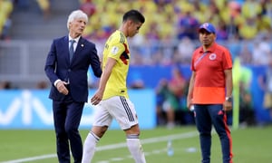 SAMARA, RUSSIA - JUNE 28: Jose Pekerman, Head coach of Colombia speaks to James Rodriguez of Colombia who looks dejected as he is substituted off due to injury during the 2018 FIFA World Cup Russia group H match between Senegal and Colombia at Samara Arena on June 28, 2018 in Samara, Russia. (Photo by Simon Hofmann - FIFA/FIFA via Getty Images)
