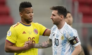 Colombia's Frank Fabra, left, and Argentina's Lionel Messi shake hands during a Copa America semifinal soccer match at the National stadium in Brasilia, Brazil, Tuesday, July 6, 2021. (AP Photo/Andre Penner)