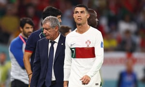Soccer Football - FIFA World Cup Qatar 2022 - Group H - South Korea v Portugal - Education City Stadium, Al Rayyan, Qatar - December 2, 2022 Portugal's Cristiano Ronaldo with coach Fernando Santos after being substituted REUTERS/Matthew Childs
