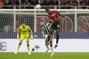 AC Milan's Rafael Leao, right, goes for the header with Newcastle's Kieran Trippier during the Champions League group F soccer match between AC Milan and Newcastle at the San Siro stadium in Milan, Italy, Tuesday, Sept. 19, 2023. (AP Photo/Antonio Calanni)