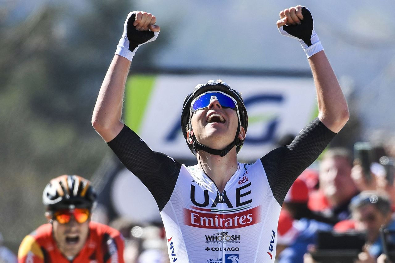 UAE Team Emirates' Slovenian rider Tadej Pogacar celebrates as he crosses the finish line during the 86th edition of the men's race 'La Fleche Wallonne', a one day cycling race (Waalse Pijl - Walloon Arrow), 194,2 km from Herve to Huy on April 19, 2023. (Photo by GOYVAERTS / Belga / AFP) / Belgium OUT