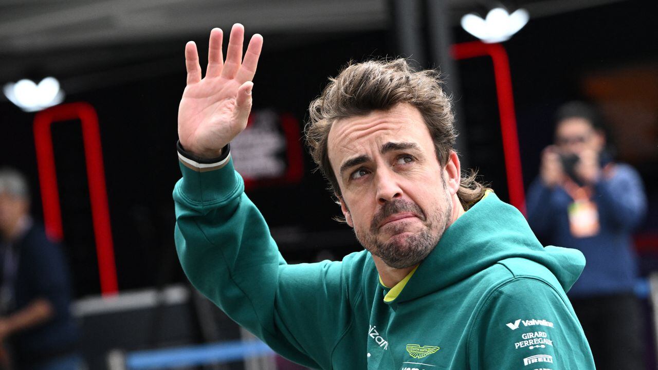 Aston Martin's Spanish driver Fernando Alonso waves after taking part in the third practice session for the Formula One Japanese Grand Prix race at the Suzuka circuit in Suzuka, Mie prefecture on April 6, 2024. (Photo by Philip FONG / AFP)