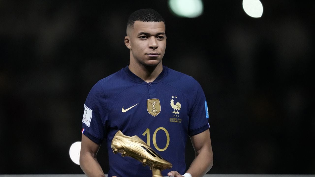 France's Kylian Mbappe holds the Golden Boot award for top goalscorer of the tournament after the World Cup final soccer match between Argentina and France at the Lusail Stadium in Lusail, Qatar, Sunday, Dec. 18, 2022. Argentina won 4-2 in a penalty shootout after the match ended tied 3-3. (AP/Martin Meissner)