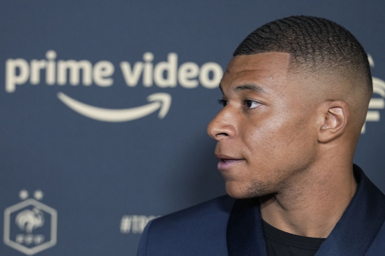 Paris Saint Germain's Kylian Mbappe poses as he arrives at the UNFP (Union of French Professional Footballers) ceremony, in Paris, France, Sunday, May 15, 2022. (AP Photo/Michel Euler)
