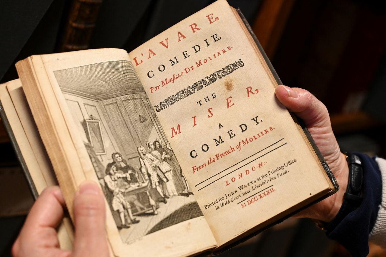 (FILES) This file photo taken on December 14, 2021 shows a page from a 1732 bilingual anthology of plays by French playwright Moliere, at the Comedie Francaise library in Paris. (Photo by BERTRAND GUAY / AFP)