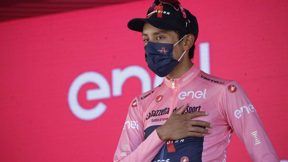 FILE - Colombia's Egan Bernal celebrates on podium after completing the final stage to win the Giro d'Italia cycling race, in Milan, Italy, Sunday, May 30, 2021. Ineos Grenadiers will be looking to make it a hat trick of victories at the Giro d’Italia, with Richard Carapaz favorite for the Italian grand tour which starts on Friday, May 6, 2022 with the first of three stages in Hungary and ends on May 29 in Verona. (AP/Luca Bruno, File)