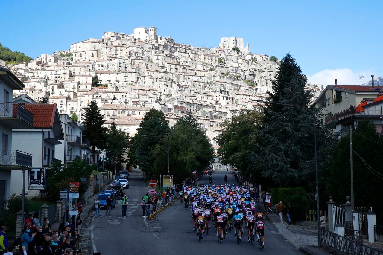 The peloton rides in the town of Morano Calabro during the 6th stage of the Giro d'Italia 2020 cycling race, a 188-kilometer route between Castrovillari and Matera on October 8, 2020. (Photo by Luca Bettini / AFP)