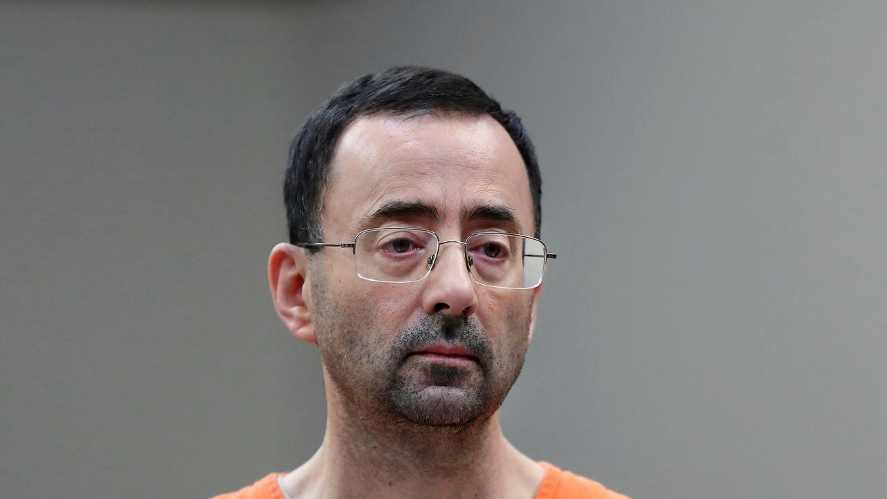 FILE - In this Nov. 22, 2017 file photo, Dr. Larry Nassar appears in court for a plea hearing in Lansing, Mich. Long sought sexual assault measures in Michigan first introduced in the wake of the Larry Nassar scandal will soon be implemented after Michigan Gov. Gretchen Whitmer signed legislation Thursday, June 29, 2023. The package will create stricter punishments for sexual assault under the guise of medical treatment and protect students who report it. It will also require the creation and distribution of comprehensive training materials for people required to report suspected child abuse and neglect. (AP Photo/Paul Sancya, File)