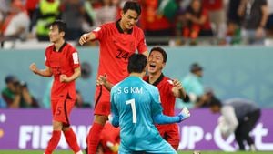 Soccer Football - FIFA World Cup Qatar 2022 - Group H - South Korea v Portugal - Education City Stadium, Al Rayyan, Qatar - December 2, 2022 South Korea's Kim Seung-gyu, Jung Woo-young and Cho Yu-min celebrate after the match as South Korea qualify for the knockout stages REUTERS/Matthew Childs