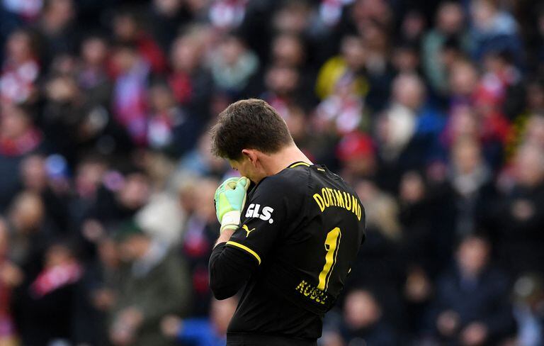 Dortmund's Swiss goalkeeper Gregor Kobel reacts during the German first division Bundesliga football match between FC Bayern Munich and BVB Borussia Dortmund in Munich, southern Germany, on April 1, 2023. (Photo by Christof STACHE / AFP) / DFL REGULATIONS PROHIBIT ANY USE OF PHOTOGRAPHS AS IMAGE SEQUENCES AND/OR QUASI-VIDEO