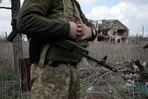A Ukrainian serviceman stands near the front line with Russia backed separatists in the small town of Pisky, near Donetsk on April 21, 2021. - Ukraine's President Volodymyr Zelensky on April 20, 2021, invited Russian leader Vladimir Putin to meet in war-torn eastern Ukraine, stressing that millions of lives were at stake from fresh fighting in the separatist conflict. (Photo by Aleksey Filippov / AFP)