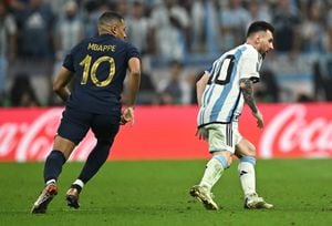 Soccer Football - FIFA World Cup Qatar 2022 - Final - Argentina v France - Lusail Stadium, Lusail, Qatar - December 18, 2022  France's Kylian Mbappe and Argentina's Lionel Messi REUTERS/Dylan Martinez