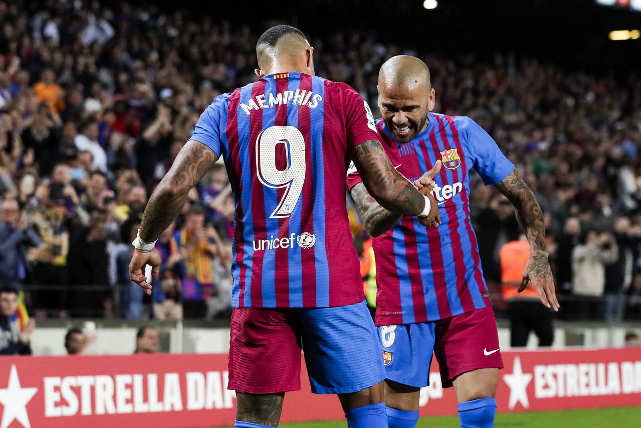 BARCELONA, SPAIN - MAY 1: Memphis Depay of FC Barcelona celebrates goal 1-0 with Dani Alves of FC Barcelona during the La Liga Santander  match between FC Barcelona v Real Mallorca at the Camp Nou on May 1, 2022 in Barcelona Spain (Photo by David S. Bustamante/Soccrates/Getty Images)