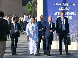 02 December 2023, United Arab Emirates, Dubai: Federal Chancellor Olaf Scholz (SPD, 2nd from right) arrives on the second day of his visit to the United Nations Climate Change Conference (COP28). Photo: Soeren Stache/dpa (Photo by Soeren Stache/picture alliance via Getty Images)