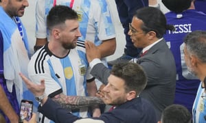 Nusret Gokce, right, is know as the chef or the Salt Bae puts his hand on the shoulder of Argentina's Lionel Messi end of the World Cup final soccer match between Argentina and France at the Lusail Stadium in Lusail, Qatar, Sunday, Dec. 18, 2022. FIFA is taking "appropriate internal action" to address breaches of World Cup protocol by a celebrity chef who held the gold trophy on the field, soccer's governing body said Thursday. (AP/Hassan Ammar)