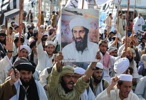 (FILES) In this file photograph taken on May 2, 2011, supporters of hardline pro-Taliban party Jamiat Ulema-i-Islam-Nazaryati (JUI-N) shout anti-US slogans during a protest in Quetta after the killing of Osama Bin Laden by US Special Forces in a ground operation in Pakistan's hill station of Abbottabad. - Almost every day, children play cricket in a patch of scorched grass and scattered rubble in Abbottabad -- all that remains of the final lair of the most wanted person on the planet. It was in this Pakistani city that Osama bin Laden was killed in the clandestine "Operation Geronimo" raid by US Navy Seals in the early hours of May 2, 2011. The operation had global repercussions and dented Pakistan's international reputation -- exposing contradictions in a country that had long served as a rear base for Al Qaeda and its Taliban allies while suffering from the effects of terrorism. (Photo by Banaras KHAN / AFP)