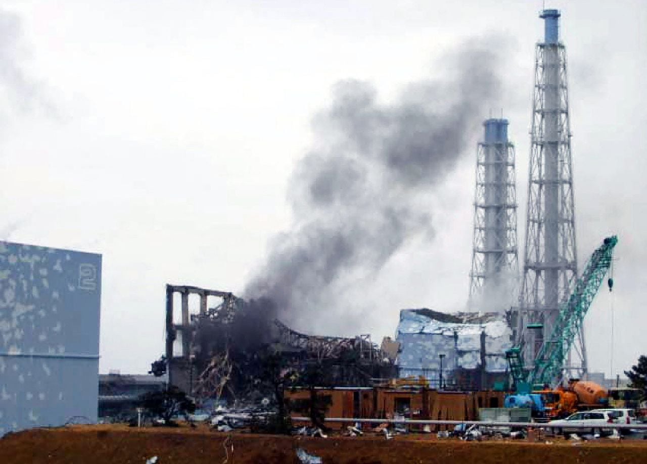 (FILES) This file handout picture released by Tokyo Electric Power Company (TEPCO) and received via Jiji Press on March 21, 2011 shows black smoke rising from reactor number three at the Fukushima Dai-ichi nuclear power plant at Okuma, Fukushima prefecture. Some 12 years after one of the world's worst nuclear disasters, Japan's premier said on August 22, 2023 the release of cooling water from the crippled Fukushima nuclear plant into the Pacific will begin on August 24, despite opposition from fishermen and protests by China. (Photo by Handout / various sources / AFP) / - Japan OUT / -----EDITORS NOTE --- RESTRICTED TO EDITORIAL USE - MANDATORY CREDIT "AFP PHOTO / TEPCO via JIJI PRESS " - NO MARKETING - NO ADVERTISING CAMPAIGNS - DISTRIBUTED AS A SERVICE TO CLIENTS