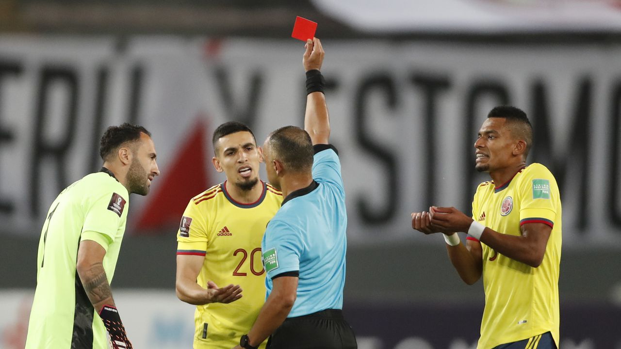 Referee Wilton Sampaio of Brazil sends off Colombia's Daniel Munoz during a qualifying soccer match for the FIFA World Cup Qatar 2022 against Peru at the National stadium in Lima, Peru, Thursday, June 3, 2021. (Paolo Aguilar/Pool via AP)
