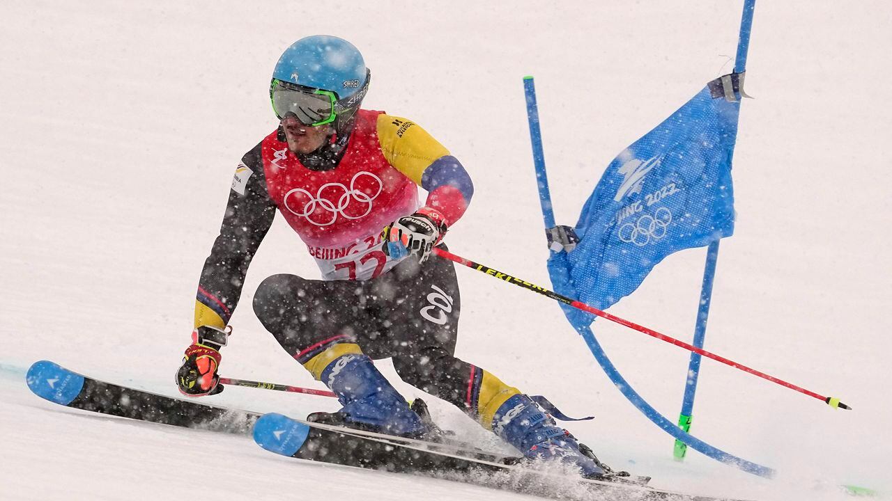 Michael Poettoz, of Colombia passes a gate during the second run of the men's giant slalom at the 2022 Winter Olympics, Sunday, Feb. 13, 2022, in the Yanqing district of Beijing. (AP Photo/Robert F. Bukaty)
