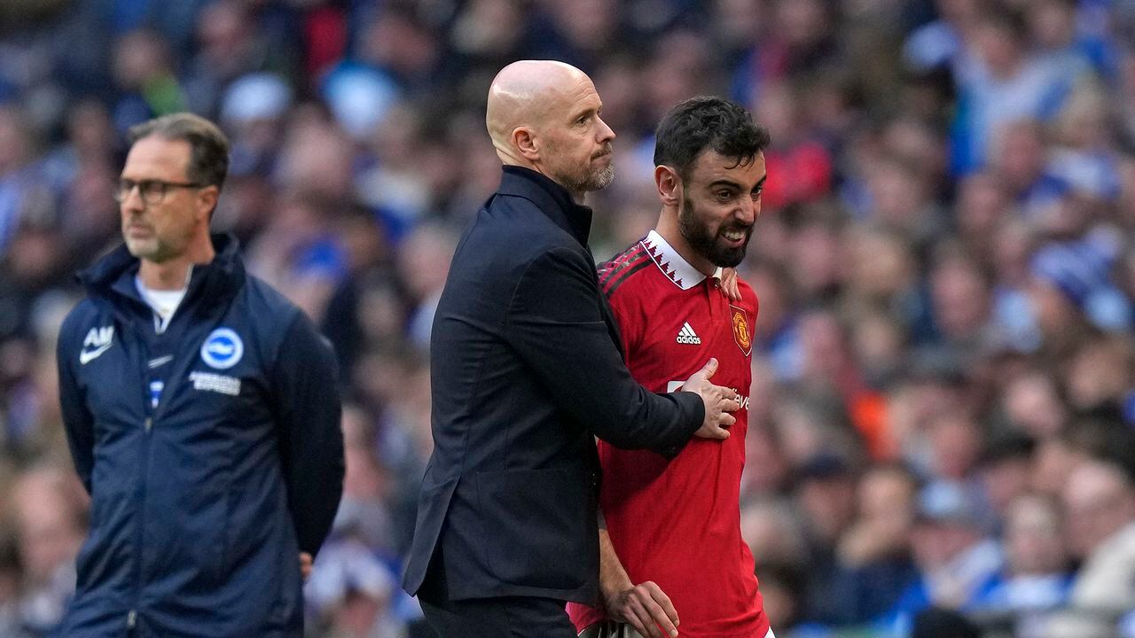 Manchester United's Bruno Fernandes is substituted by Manchester United's head coach Erik ten Hag during the English FA Cup semifinal soccer match between Brighton and Hove Albion and Manchester United at Wembley Stadium in London, Sunday, April 23, 2023. (AP Photo/Alastair Grant)