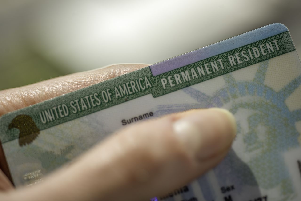 (Green) card of USA on blurred background.