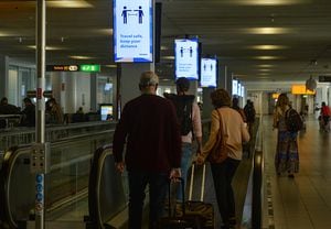 Travel safe, keep your distance signs at Amsterdam Airport Schiphol.
On Friday, August 6, 2021, in Amsterdam Airport Schiphol, Schiphol, Netherlands. (Photo by Artur Widak/NurPhoto via Getty Images)