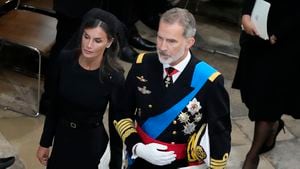 Spain's King Felipe VI and Queen Letizia walk together after the coffin of Queen Elizabeth II is carried out of Westminster Abbey during her funeral in central London, Monday, Sept. 19, 2022. The Queen, who died aged 96 on Sept. 8, will be buried at Windsor alongside her late husband, Prince Philip, who died last year. (AP Photo/Frank Augstein, Pool)