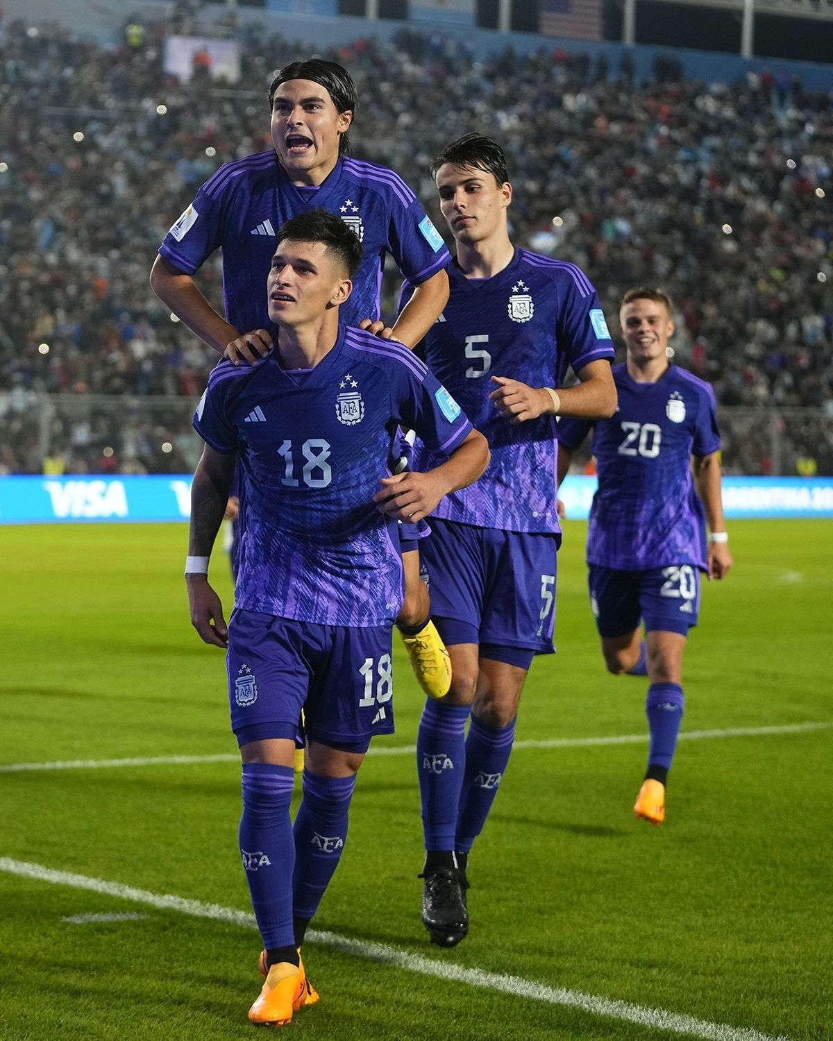 CORRECTS NUMBER OF GOALS SCORED - Argentina's Brian Aguirre (18) celebrates with his teammates after scoring his side's fourth goal against New Zealand during a FIFA U-20 World Cup Group A soccer match at the San Juan stadium in San Juan, Argentina, Friday, May 26, 2023. (AP Photo/Natacha Pisarenko)