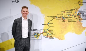 PARIS, FRANCE - OCTOBER 27: Tadej Pogacar of Slovenia and UAE Team Emirates and the map showing the route of the men's race during the 110th Tour de France 2023 and 2nd Tour de France Femmes 2023 - Route Presentation / #TDF2023 / #TDFF2023 / on October 27, 2022 in Paris, France. (Photo by Alex Broadway/Getty Images)