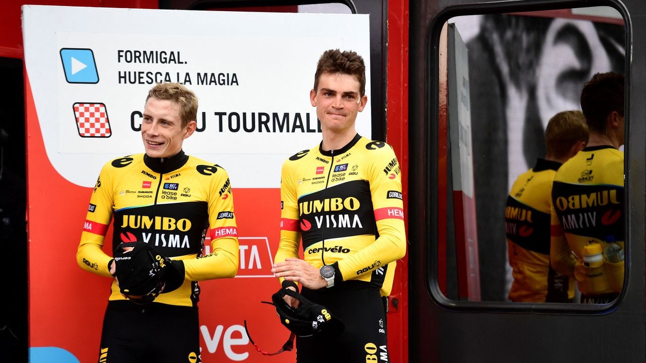 Overall leader of the race Team Jumbo-Visma's US rider Sepp Kuss and third placed Team Jumbo-Visma's Danish rider Jonas Vingegaard (L) celebrate on the podium after the stage 13 of the 2023 La Vuelta cycling tour of Spain, a 134,7 km race between Formigal and the Col du Tourmalet in France, on September 8, 2023. (Photo by ANDER GILLENEA / AFP)