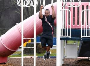 Brandon Taylor, of McKeesport, Pa., takes advantage of a break in the rain to get some exercise in at Renziehausen Park Monday, Dec. 27, 2021, in McKeesport, Pa. Mr. Taylor said he recently quit smoking. (Nate Guidry/Pittsburgh Post-Gazette via AP)