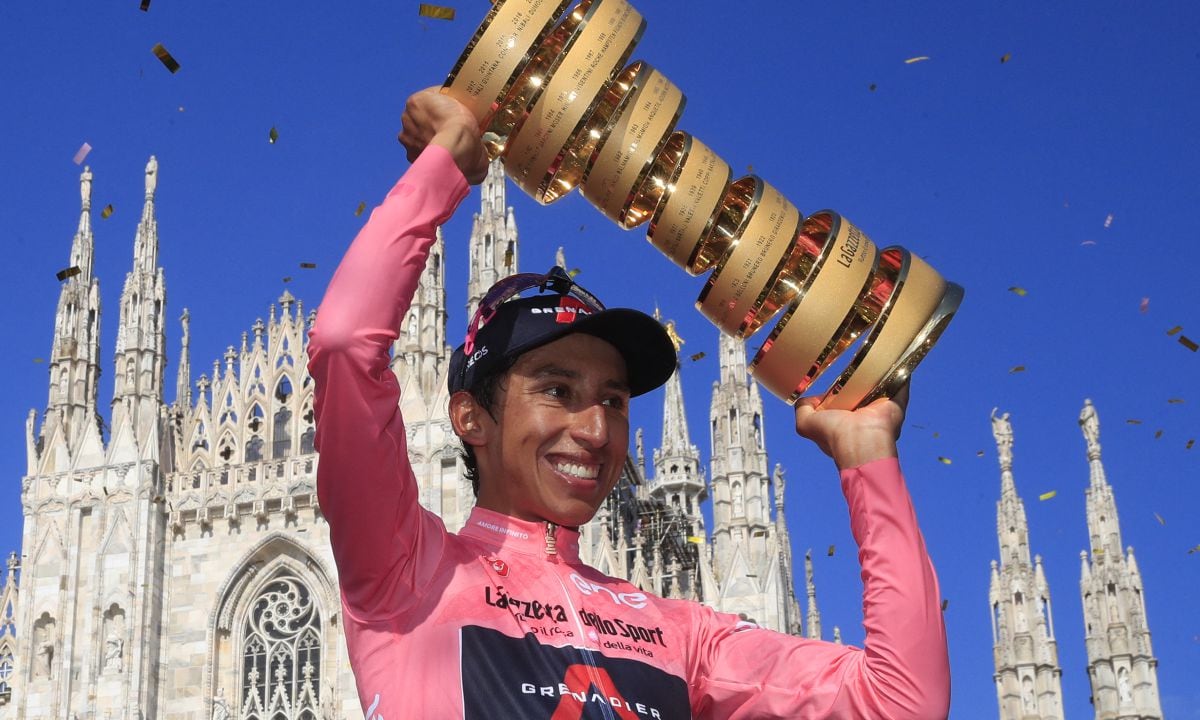 (FILES) In this file photo taken on May 30, 2021, Team Ineos rider Colombia's Egan Bernal celebrates with the race's Trofeo Senza Fine (Endless Trophy) on the podium after winning the Giro d'Italia 2021 cycling race following the 21st and last stage in Milan, Italy. Former Tour de France winner Egan Bernal was "conscious" and "stable" in hospital following a training accident near his home town in Colombia, his cycling team Ineos Grenadiers said on Monday January 24, 2022.
AFP/Luca Bettini