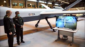 This handout photo provided by Iran's Revolutionary Guard Corps (IRGC) official website via SEPAH News on May 21, 2021, shows General Hossein Salami (L) and Amir Ali Hajizadeh commander of Aerospace Force of the IRGC, unveiling a new combat drone called "Gaza" in tribute to Palestinians, in the capital Tehran, hours after a ceasefire between Israel and Palestinian armed factions took effect. - The drone is capable of carrying 13 bombs while flying at over 35,000 feet, with a speed of almost 350 kilometres per hour for 20 hours, Salami said. (Photo by - / various sources / AFP) / RESTRICTED TO EDITORIAL USE - MANDATORY CREDIT "AFP PHOTO / Iran's Revolutionary Guard via SEPAH NEWS" - NO MARKETING - NO ADVERTISING CAMPAIGNS - DISTRIBUTED AS A SERVICE TO CLIENTS