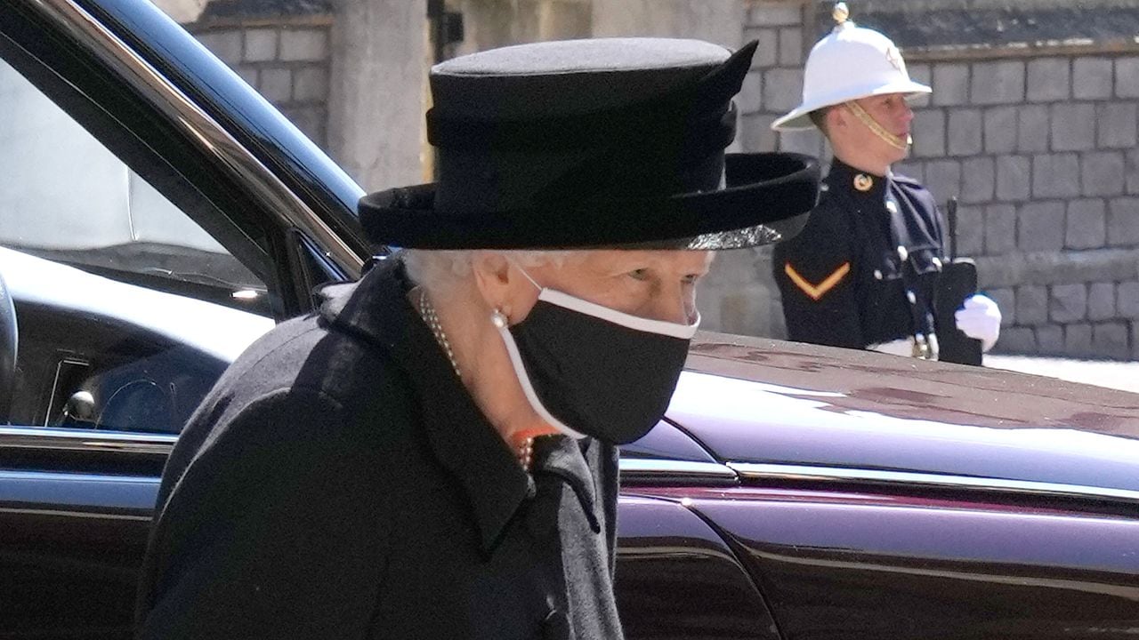 Queen Elizabeth II arrives for the funeral service of Britain's Prince Philip, Duke of Edinburgh inside St George's Chapel in Windsor Castle in Windsor, west of London, on April 17, 2021. - Philip, who was married to Queen Elizabeth II for 73 years, died on April 9 aged 99 just weeks after a month-long stay in hospital for treatment to a heart condition and an infection. (Photo by Jonathan Brady / POOL / AFP)