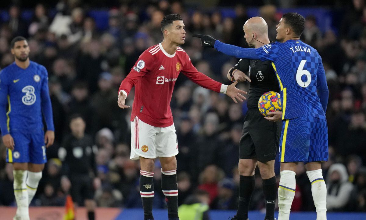 Manchester United's Cristiano Ronaldo talks to Referee Anthony Taylor while Chelsea's Thiago Silva, right, gestures during the English Premier League soccer match between Chelsea and Manchester United at Stamford Bridge stadium in London, Sunday, Nov. 28, 2021. (AP/Kirsty Wigglesworth)