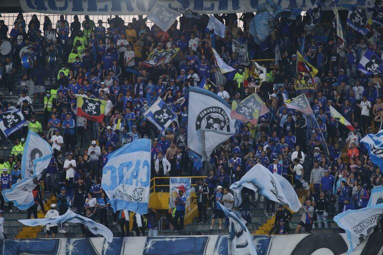 Millonarios fans support their team during the Colombian BetPlay League match between Millonarios and Independiente Santa Fe at Estadio Nemesio Camacho in Bogota, Colombia on April 24, 2022. Final score 2-1. (Photo by Daniel Garzon Herazo/NurPhoto via Getty Images)