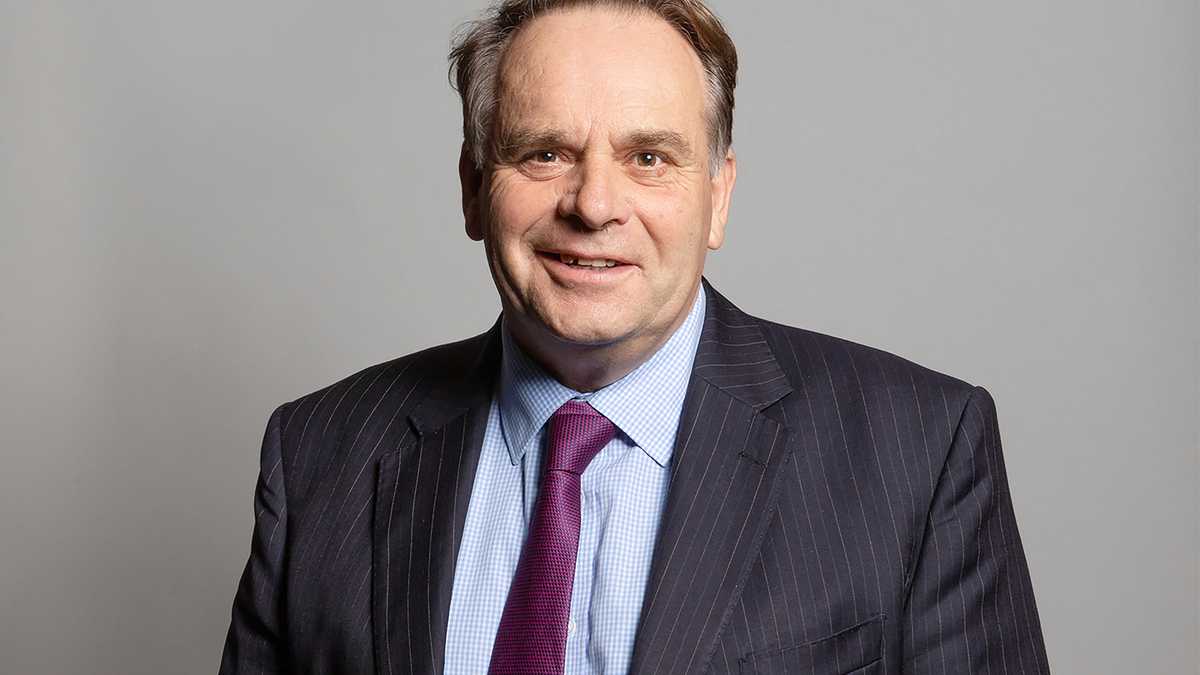 An undated handout photograph released by the UK Parliament shows Conservative MP for Tiverton and Honiton, Neil Parish, posing for an official portrait photograph at the Houses of Parliament in London. - Britain's ruling Conservative party on Friday suspended one of its MPs pending an investigation into claims he watched pornography on his mobile phone in the House of Commons chamber. The identification of MP Neil Parish, 65, ends days of speculation since the allegation emerged on Tuesday, amid accusations of a misogynistic environment in parliament. (Photo by Richard Townshend / UK PARLIAMENT / AFP) / RESTRICTED TO EDITORIAL USE - NO USE FOR ENTERTAINMENT, SATIRICAL, ADVERTISING PURPOSES - MANDATORY CREDIT " AFP PHOTO / RICHARD TOWNSHEND /UK Parliament"