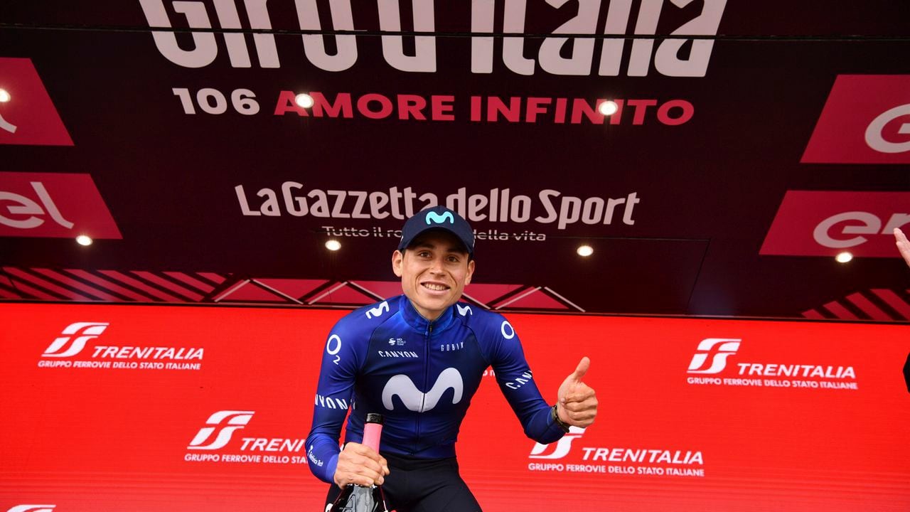 Colombia's Einer Rubio Reyes poses on podium after winning the 13rd stage of the Giro D'Italia, tour of Italy cycling race, from Borgofranco D'Ivrea to Crans Montana, Friday, May 19, 2023. (Massimo Paolone/LaPresse via AP)